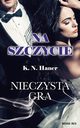 Na szczycie. Nieczysta gra, K.N. Haner